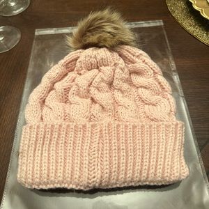 New in packaging. Women’s Light Pink Puff Beanie Perfect for the Coldness.